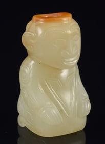 Jade bead in the form of a kneeling man. China. Han period (2nd century BC - 2nd century AD).
