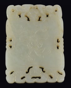 Rectangular jade pendant. China. 19th century. Surface carved with flowers. 2.75 x 1.75in.