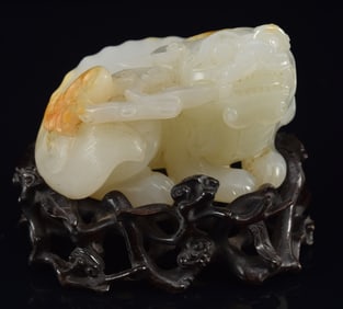 Jade carving of a one horned chih lung with a branch of immortality mushroom. Chien Lung period