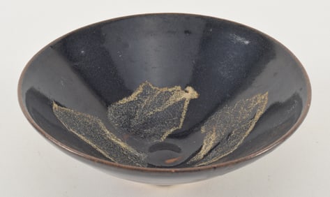 Stoneware tea bowl. China. Chien ware with leaf resist pattern and dark brown glaze. 6.25in.