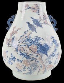 Porcelain vase. China. 18th century. Underglaze blue and red decoration of magpies in flowering