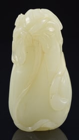 Celadon jade snuff bottle. China. 18th century. Carved as a gourd with foliage. 2.5in.