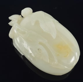 Celadon jade snuff bottle. China. 18th century. Carved as a gourd with foliage with matching