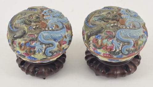Pair of porcelain incense boxes. China. 19th century. Molded and polychromed decoration of dragons