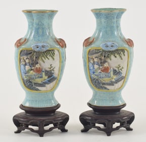 Pair of porcelain vases. China. 19th century. Chien Lung marks. Molded decoration of panels with