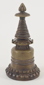 Bronze stupa. Tibet. 18th century. surface inlaid with silver and copper. Offering plate intact.