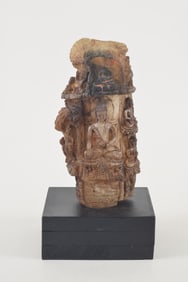 Rock crystal lingam. Nepal. 17th century. Surface carved with buddhas and jatarka tales. Traces of