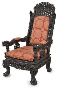 19th century Chinese ornately carved hardwood armchair. Arms and back supports carved with dragon