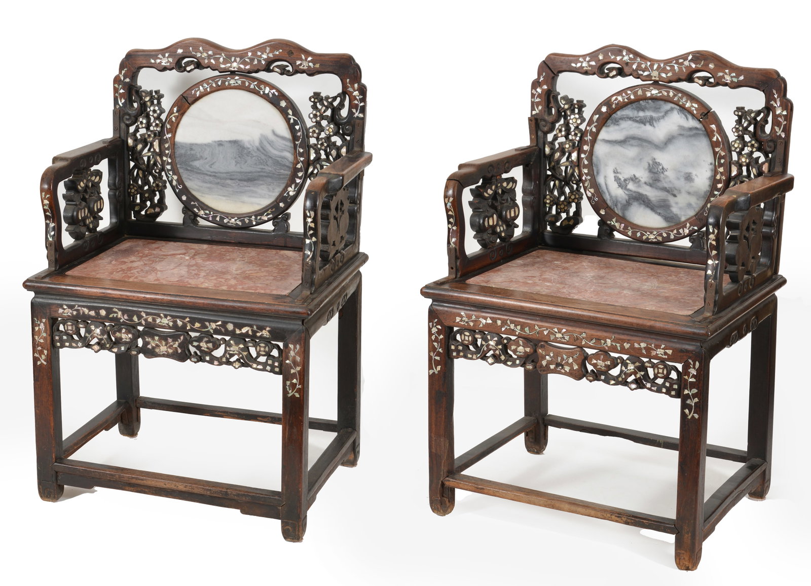 Pair of Chinese marble and mother of pearl inlaid hardwood armchairs. Backs inset with round: Pair of Chinese marble and mother of pearl inlaid hardwood armchairs. Backs inset with round dreamstone plaques. One support on each chair damaged but present. Other spots of wear and repair.