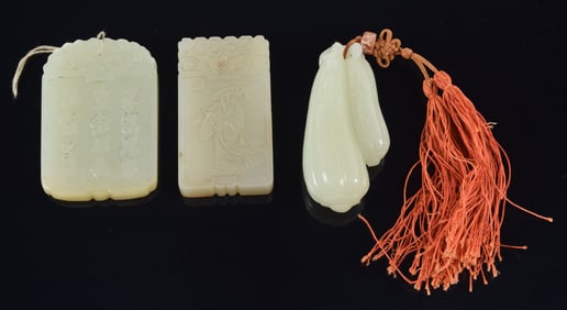 3 jade pendants. China. Early 20th century. To include: 2 rectangular plaques and a melon grouping.