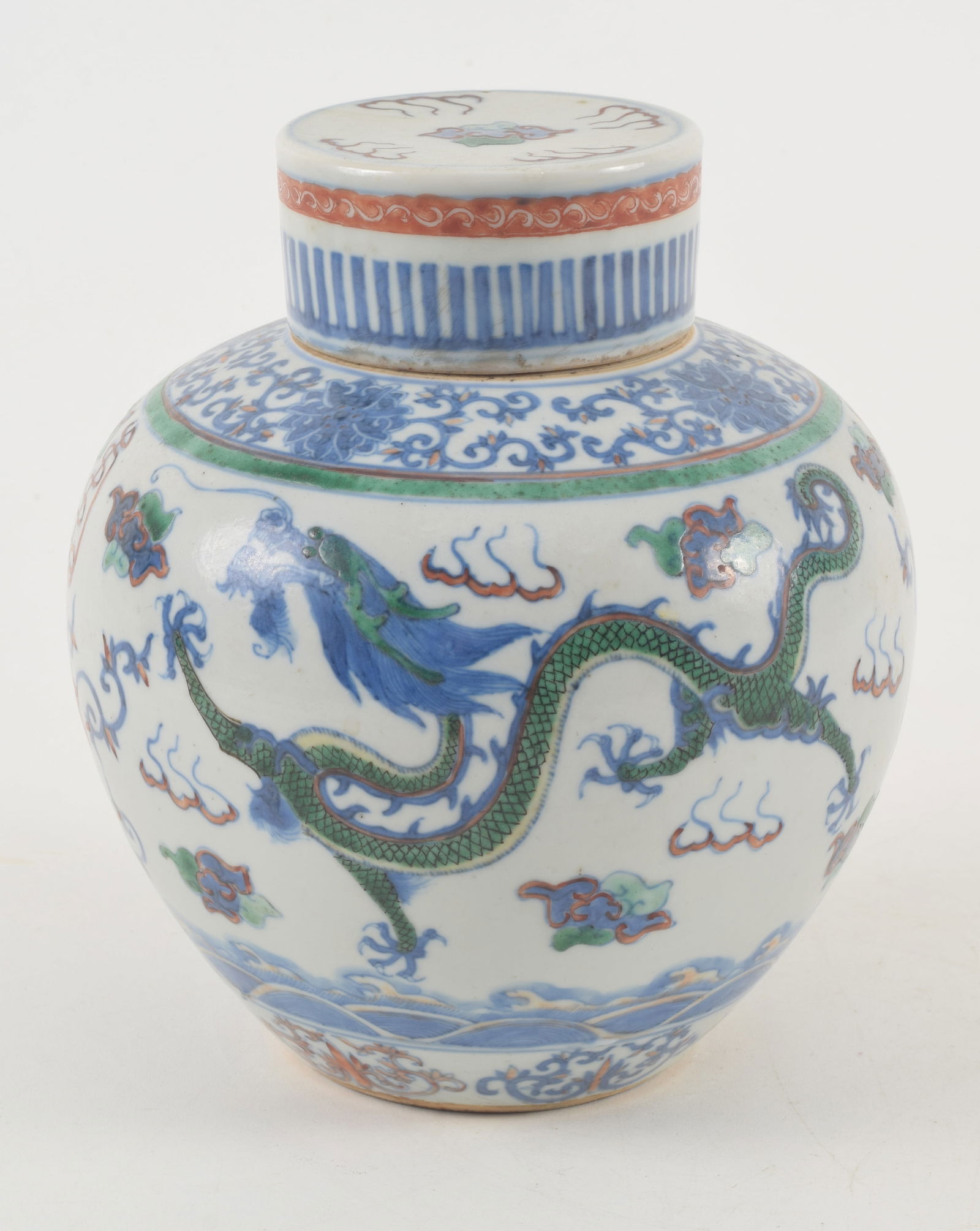 Porcelain covered jar. China. 19th century or earlier. Yung Cheng mark. Tou tsai ware. Decoration of: Porcelain covered jar. China. 19th century or earlier. Yung Cheng mark. Tou tsai ware. Decoration of shou characters in foliation and dragons. Repair to the mouth. 7.25in.