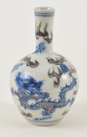 Miniature porcelain vase. China. Early 20th century. Decoration of dragons and clouds in underglaze