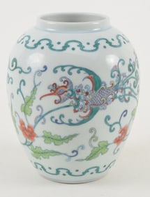 Porcelain vase. China. 18th century. Oviform shape. Tou tsai decoration of an abstracted foliated