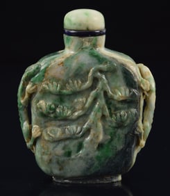 Jade snuff bottle. China. Surface carved with chih lung and flowers. 2.25in.