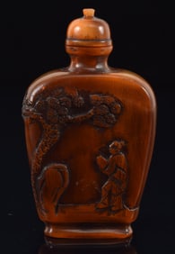 Horn snuff bottle. China. Early 20th century. Surface carved with the immortals. 2.25in.