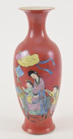 Porcelain vase. China. Early 20th century. Famille rose decoration of women and children on an iron