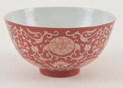 Porcelain cup. China. Kuang Hsu mark (1875-1908). Coral red decoration of stylized floral scrolling.