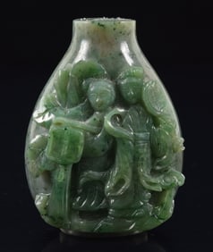 Jade snuff bottle. China. Ca. 1900. Surface carved in high relief with two goddesses. 2.5in.