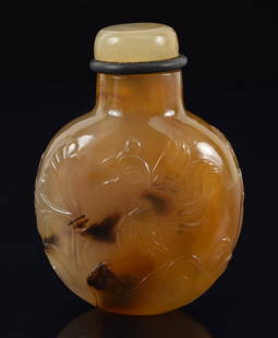 Agate snuff bottle. China. Ca. 1850. Well hollowed. Surface carved in relief with a bow hunter with: Agate snuff bottle. China. Ca. 1850. Well hollowed. Surface carved in relief with a bow hunter with game birds. 2in.