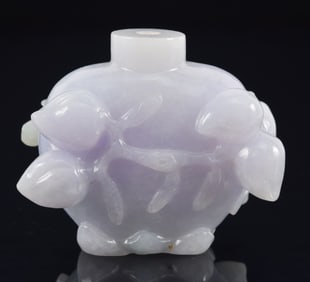 Lavender jadeite snuff bottle. China. Surface carved with peaches and birds. 1.5in.