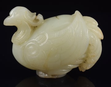 Jade staff finial. China. 18th century. Carved as a phoenix. 2.75 x 2in.