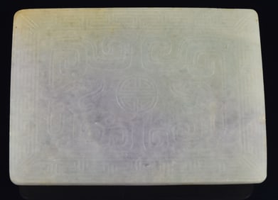 Jadeite belt plaque. China. 19th century. Lavender and green stone engraved with chih lung and a