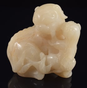 Jade carving. China. 19th century. Study of a foo dog and cub. 3 x 3in.