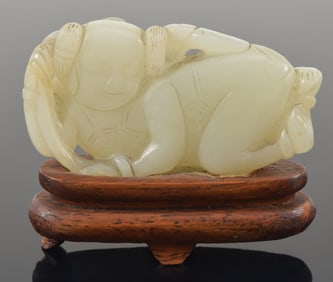 Jade boy. China. 19th century. Fitted stand. 2.5in.