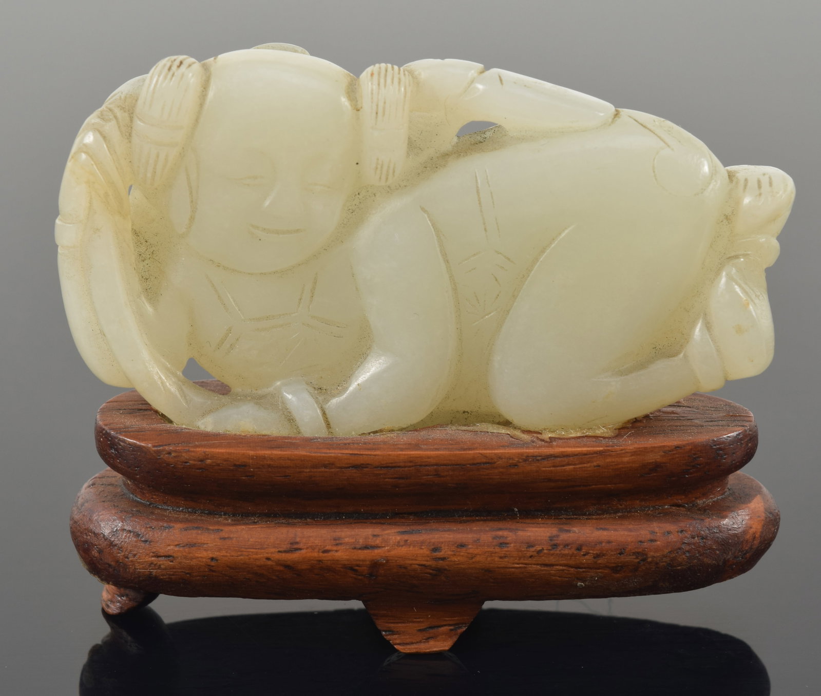 Jade boy. China. 19th century. Fitted stand. 2.5in.: Jade boy. China. 19th century. Fitted stand. 2.5in.