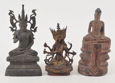 3 Buddhas. Southeast Asia. 19th/20th century. 2 bronze (one gilded) and one of carved wood. Largest