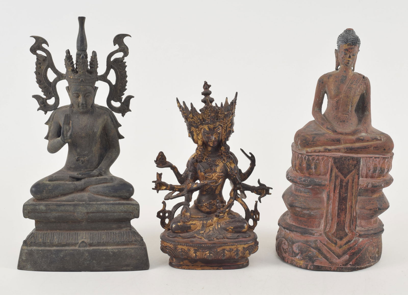 3 Buddhas. Southeast Asia. 19th/20th century. 2 bronze (one gilded) and one of carved wood. Largest (1 of 10)