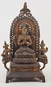 Carved wooden image. Nepal. 19th century. Enthroned seated image of Shadakhsharilokeshvara with two