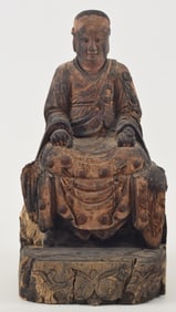 Carved wooden image of a high buddhist abbot. China. Ming period figure on a later replaced throne.