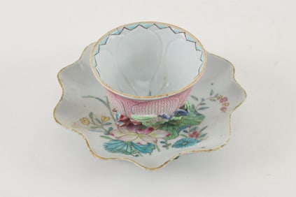 Porcelain cup and saucer. China. 18th century. Sculpted as a lotus plant with famille rose