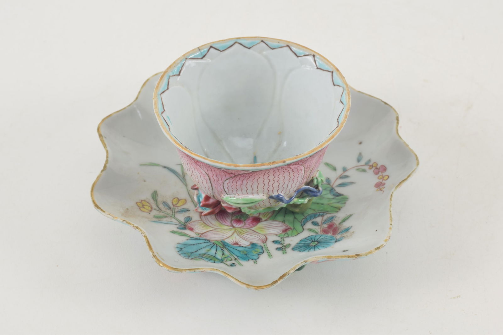 Porcelain cup and saucer. China. 18th century. Sculpted as a lotus plant with famille rose (1 of 3)