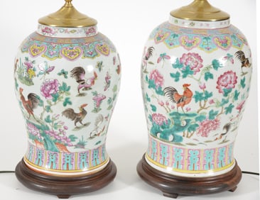 Near pair of baluster jars. China. 19th century. Famille rose decoration of roosters and flowers.