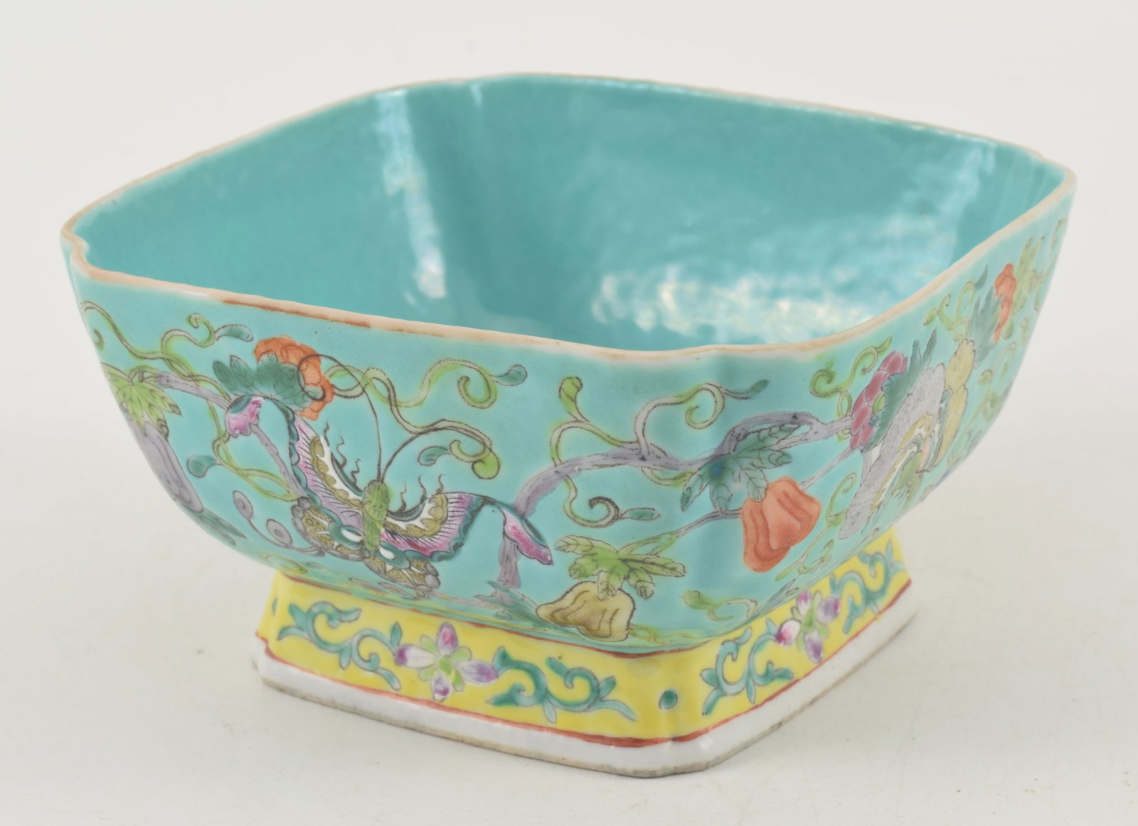 Square porcelain serving bowl. China. 19th century. Decoration of flowers and foliage on a turquoise: Square porcelain serving bowl. China. 19th century. Decoration of flowers and foliage on a turquoise ground. Chia Ching mark. 5 x 5 x 3in.
