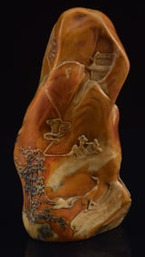 Soapstone seal. China. 20th century. Mountain shaped accented with relief carved pavilions, cranes