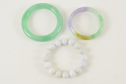 3 jadeite pieces. 2 bracelets and a set of beads.
