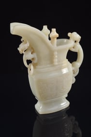 Jade ewer. China. 19th/early 20th century. White stone. Kuang with a chih lung handle. 6.75 x