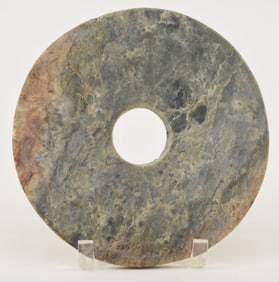 Jade bi. China. Archaic style. Plain surface. 8in.