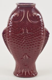 Porcelain vase. China. 18th/19th century. Double fish form. Deep crushed strawberry lang yao glaze.