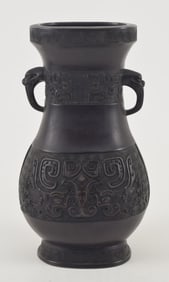 Bronze vase. China. 18th/19th century. Archaic Hu form. Surface with tao tieh masks inlaid with