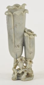 Jade vase. China. Ming period (1368-1644). Celadon-chicken bone color. Carved as flowering