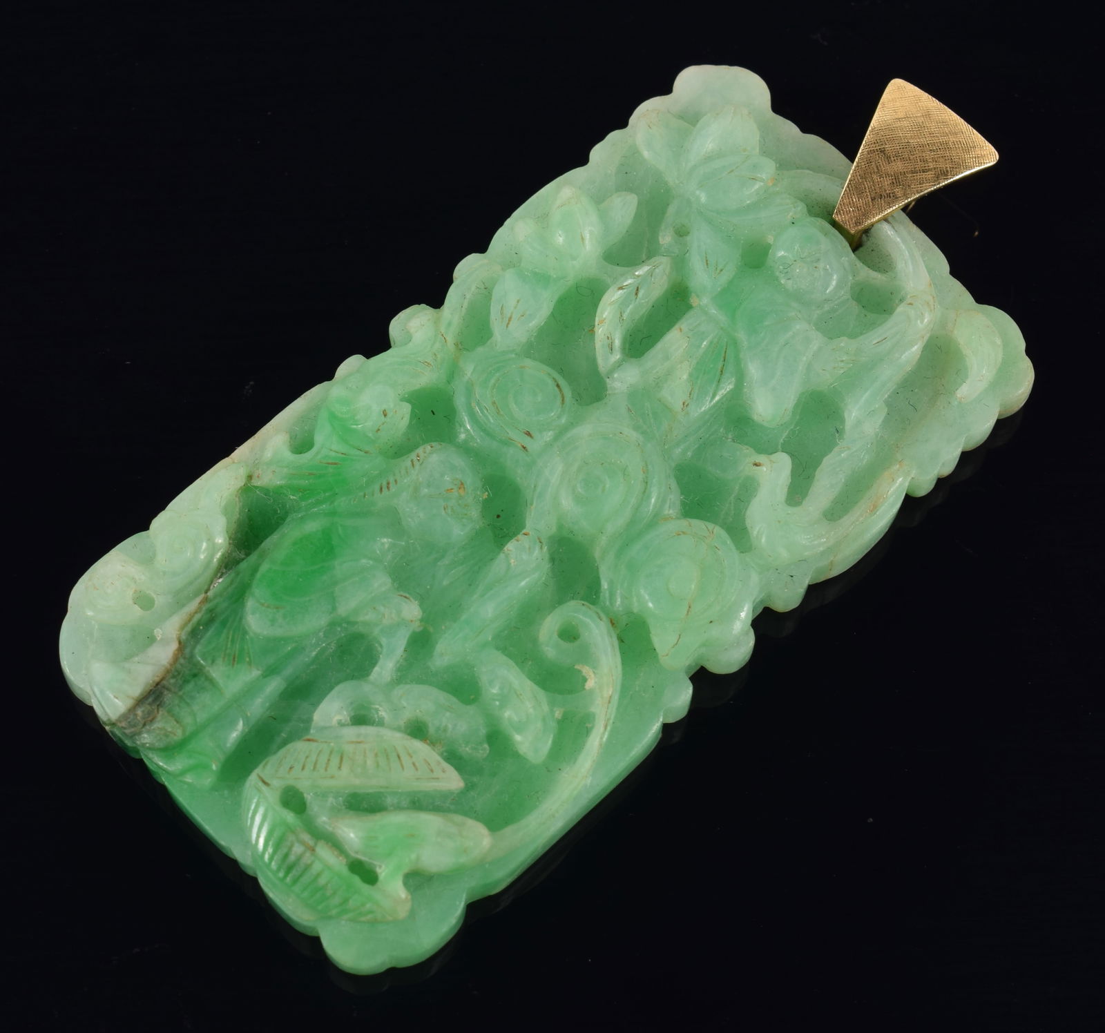Jadeite pendant. China. 19th century. Rectangular form. Surface carved with the immortals. 2.5in. (1 of 4)