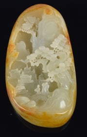 20th century jade pebble carved with a landscape. 3in.