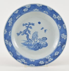 Porcelain plate. China. 19th century. Monochrome blue exterior with a prunus border and longevity