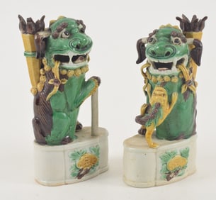 Pair of san tsai incense stick holders. Foo dog form. China. 18th century. 6.25in high. Chips.