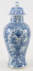 Porcelain vase. China. 19th century. Baluster form covered jar. Underglaze blue decoration of floral