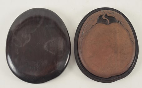 Inkstone carved as a peach. China. 18th century. Signed. Fitted box. 4.5in length.
